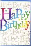 The photograph features a striking birthday card that instantly communicates celebration, as if the spirit of a Hanwell birthday party has been distilled onto paper. The phrase Happy Birthday dominates the front in confident, oversized letters, each one coloured with a smooth rainbow blend. The colours transition seamlessly from deep cherry red into vivid pink, glowing amber, sunshine yellow, bright grassy green, aquamarine, and rich indigo, creating a harmonious spectrum that feels as playful as bunting strung above a garden gate near Elthorne Park. The letters have a softly shaded, almost airbrushed appearance, giving them a slight three-dimensional quality, as though they hover just above the surface of the card. Beneath and around this main greeting, the background is filled with a repeating, cursive script that quietly repeats Happy Birthday to you in a delicate golden tone. This script appears to be lightly glittered or printed with metallic ink, catching and reflecting the light in fine, twinkling highlights, like distant fairy lights against a twilight sky over Hanwell. Small decorative specks and miniature star-like shapes in complementary rainbow colours are scattered across the design, adding a dynamic, confetti-like effect. The overall look balances bold fun with polished elegance, making the card feel suitable for any age-from a child's party in a local community hall to a milestone celebration in a family home off Uxbridge Road. With its rich colours, subtle sparkle, and layered script, the card offers not just a message, but a visual chorus of birthday wishes, perfect to pair with a fresh floral delivery to brighten someone's special day in Hanwell.
