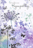 This sympathy card reads like a soft-spoken condolence, painted in the cool, soothing tones of lavender, indigo, and washed blue that might echo a still Hanwell sky at dusk. Across the centre, airy silhouettes of wildflowers stretch upward on fine, tapering stems, each crowned with delicate, umbrella-like clusters of tiny blossoms. The flowers are rendered in translucent layers, so that the colours overlap gently-dusky purple blending into powder blue, a trace of soft green peeking through-creating an almost musical rhythm of hues. Around the blooms, the background drifts in pale mauve, silver-grey, and muted aqua, loosely brushed to suggest distant foliage without crowding the eye. Here and there, butterflies hover near the flower heads, their light outlines and faintly coloured wings suggesting movement and transformation rather than sharp detail. The entire composition feels weightless, like breath on glass, while still grounded in a profound sense of care. The phrase "With Sincere Sympathy" appears in an elegant script above or beside the floral scene, its graceful lines echoing the tall, slender stems below. As a florist who often prepares condolence flowers for families in Hanwell, I recognise in this card the same quiet strength people look for when words are hard to find. It is gentle, respectful, and unhurried, the perfect accompaniment to funeral tributes or sympathy bouquets delivered to homes near Boston Road, churches, or small family gatherings, offering a visual embrace that reassures without overwhelming.